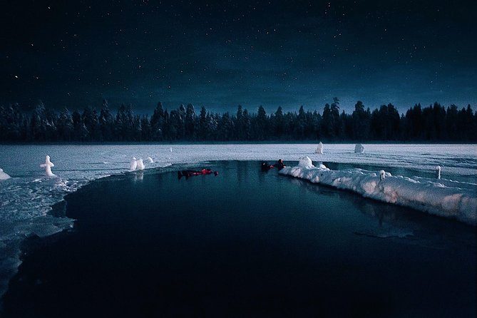 Aurora Ice Floating in Rovaniemi - Getting into a lake that is almost frozen