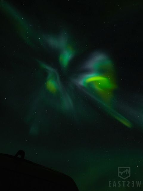 From Reykjavik: Northern Lights Tour with Hot Cocoa & Photos - What happens if the sky stays cloudy?