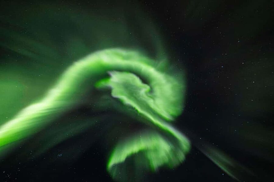 From Tromsø: Northern Lights Visit at Camp Tamok - Firelight, stew, and the lávvu