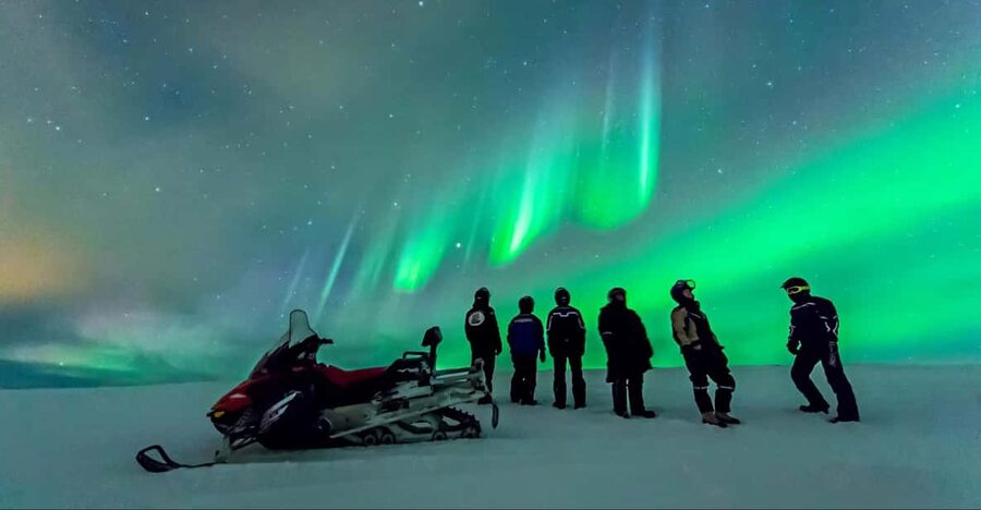 Levi: Northern Lights Snowmobile Safari and Campfire Picnic - Riding through the Arctic forest