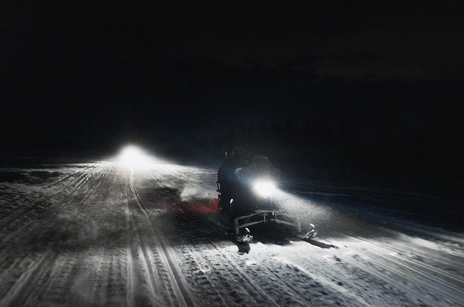 Northern lights safari by snowmobile - The ride through forests, swamps, and frozen country