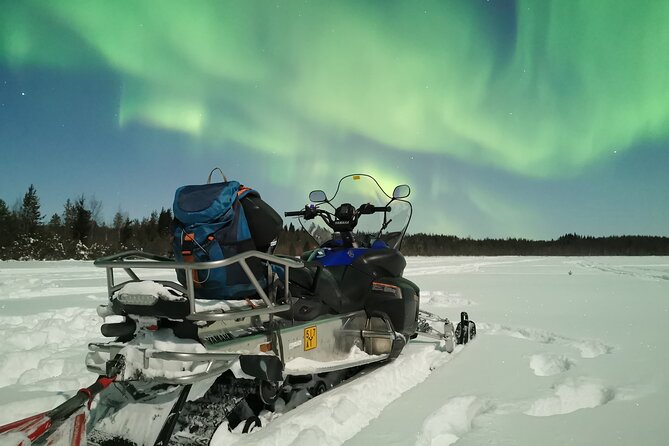 Northern lights safari by snowmobile - Getting dressed for a Finnish winter night