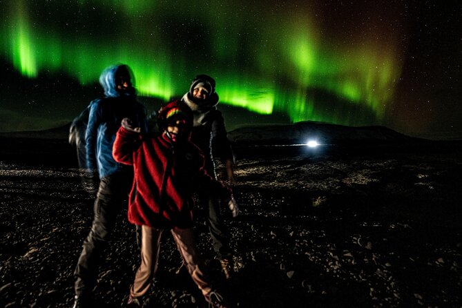 Reykjavik: Northern Lights Comfort Coach with Surprise - Stop one: getting clear of city lights