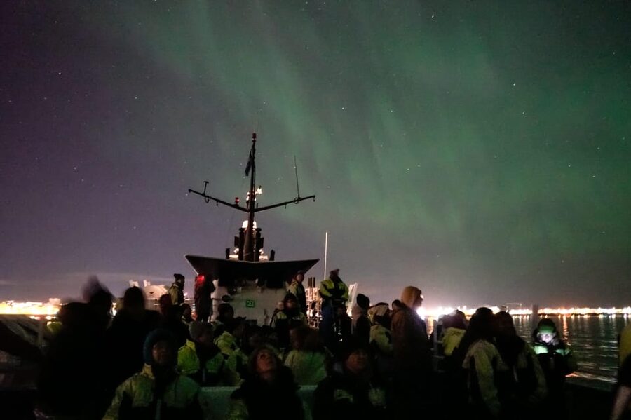 Reykjavik: Northern Lights Guided Boat Tour with Photos - Finding darker water for the aurora