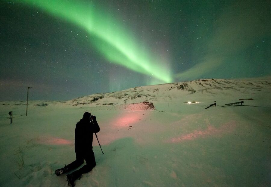 Reykjavik: Northern Lights Tour with Free Photos & Hot Cocoa - Finding a dark place under Iceland’s winter sky