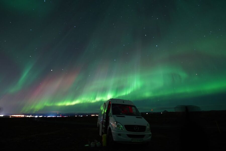 Reykjavik: Premium Northern Lights Tour with Free Photos - What guides add to the four-hour outing