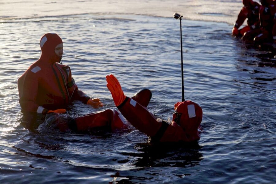 Rovaniemi: Arctic Ice Floating and Northern Lights Tour - Getting ready in the thermal rescue suit