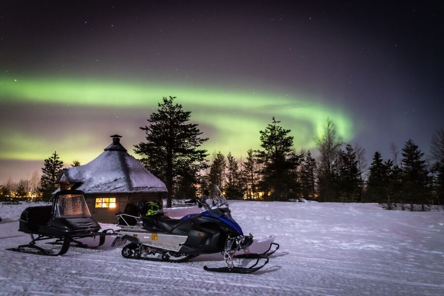 Rovaniemi: Aurora Borealis Snowmobile Safari with Campfire - Riding through forests, lakes, and open snow