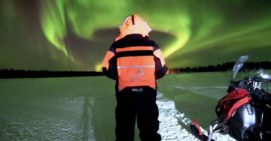 Rovaniemi: Search for Northern Lights Snowmobiling Trip - Sharing a snowmobile through the forest
