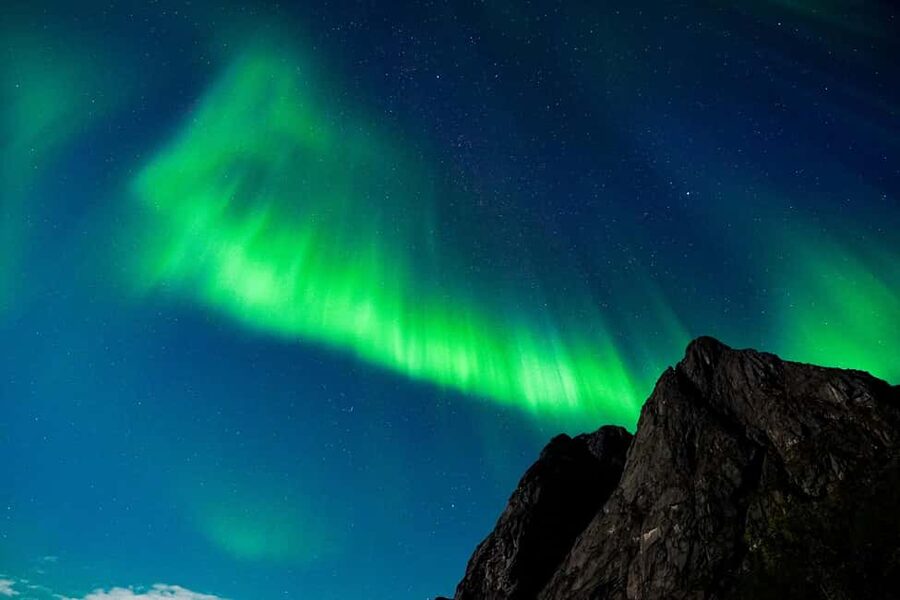 Tromsø: Northern Lights Bus Tour with Snacks and Photos - Chasing clear skies beyond Tromsø