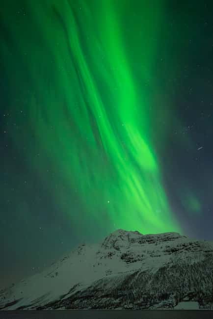 Tromsø: Northern Lights in a Minivan with Free Photos and a Hot Meal - Choosing a Dark Location Behind the Fjords